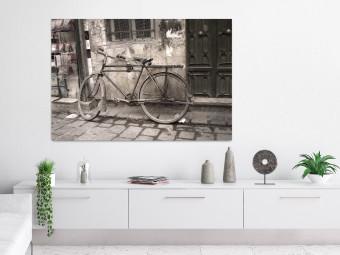 Poster Two-Wheeler - urban scene of a stone street with a vintage-style bicycle