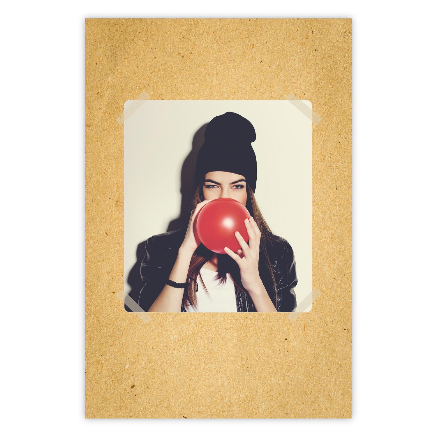 Poster Photo Portrait - figure of a young woman blowing a balloon against a cardboard background