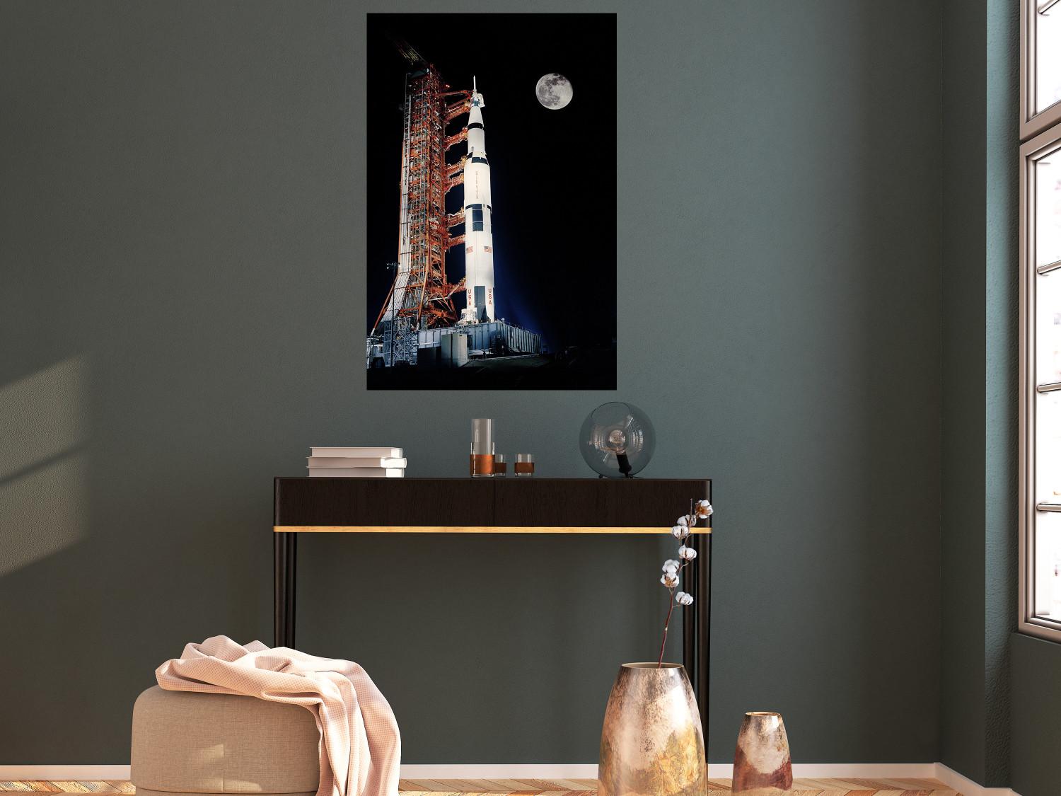 Poster Destination - illuminated rocket in a docking station against the moon backdrop