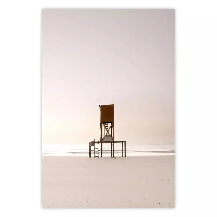 September Dawn - lifeguard tower on the beach in the light of bright sky