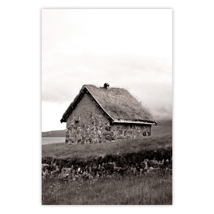 Fisherman's Hut - landscape of a field and a stone house against a clear sky