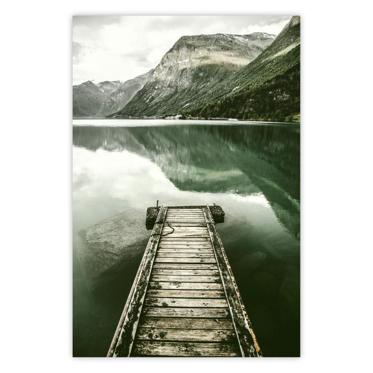 Silence - landscape of a lake with a wooden pier against mountains and sky