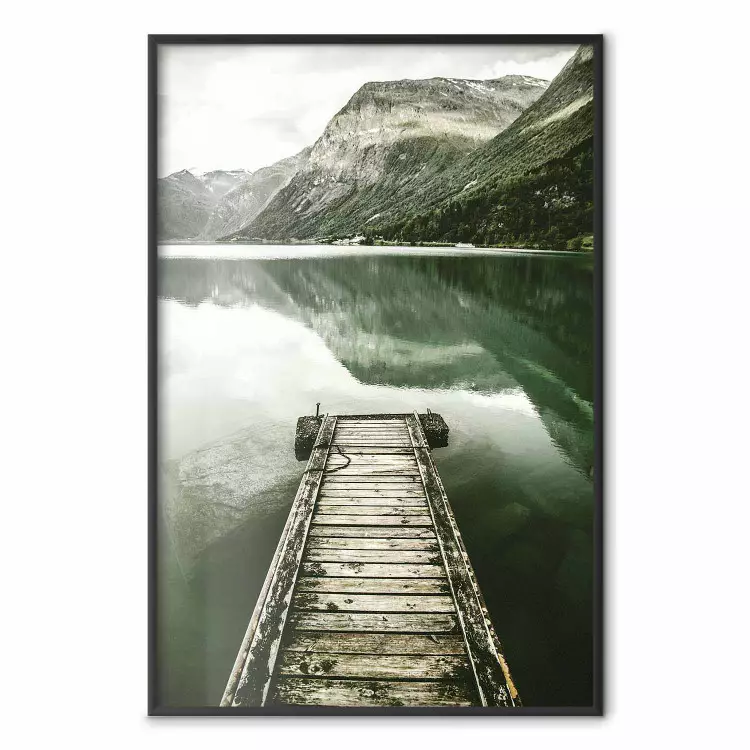 Silence - landscape of a lake with a wooden pier against mountains and sky