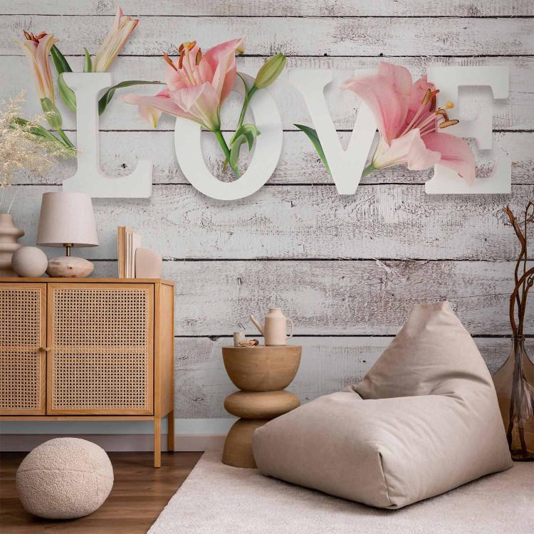 Flowers in love - inscription in English on a light background with wood texture
