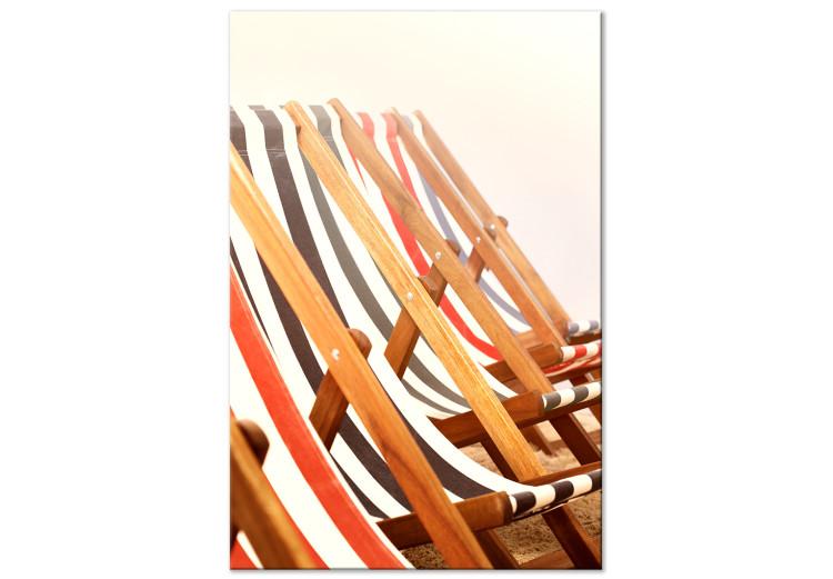 Canvas Print Wooden beach sun loungers - photo on a beige background