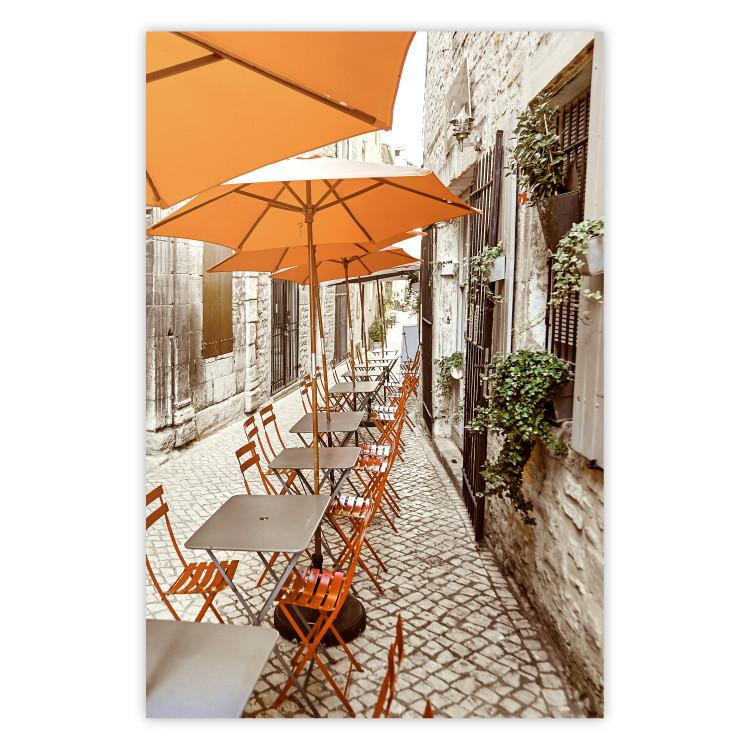 Summer Morning - restaurant tables and street in an Italian town