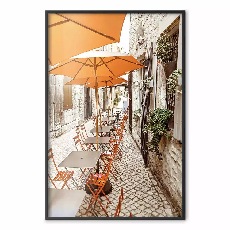 Summer Morning - restaurant tables and street in an Italian town