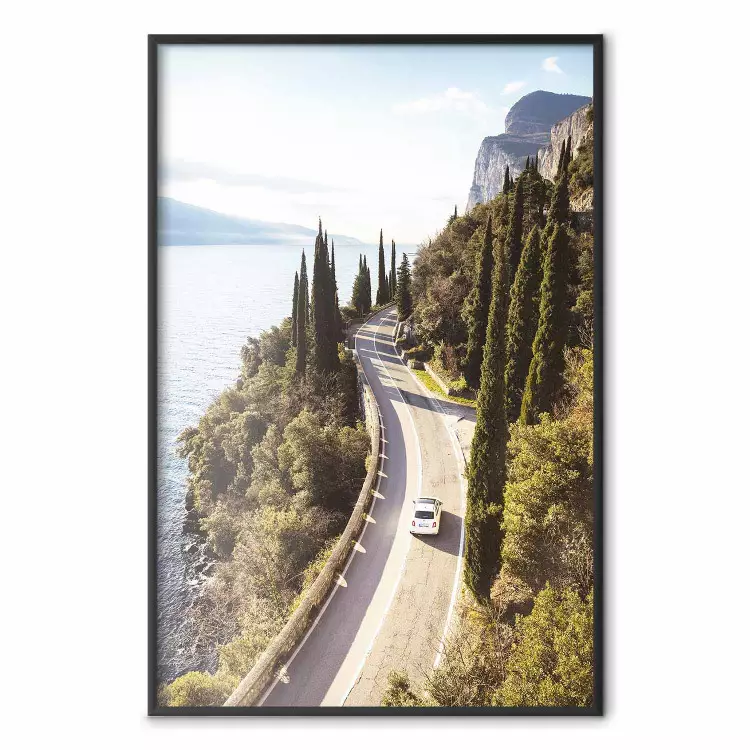 Gardesana - lake and road amidst greenery against the backdrop of Italy's landscape