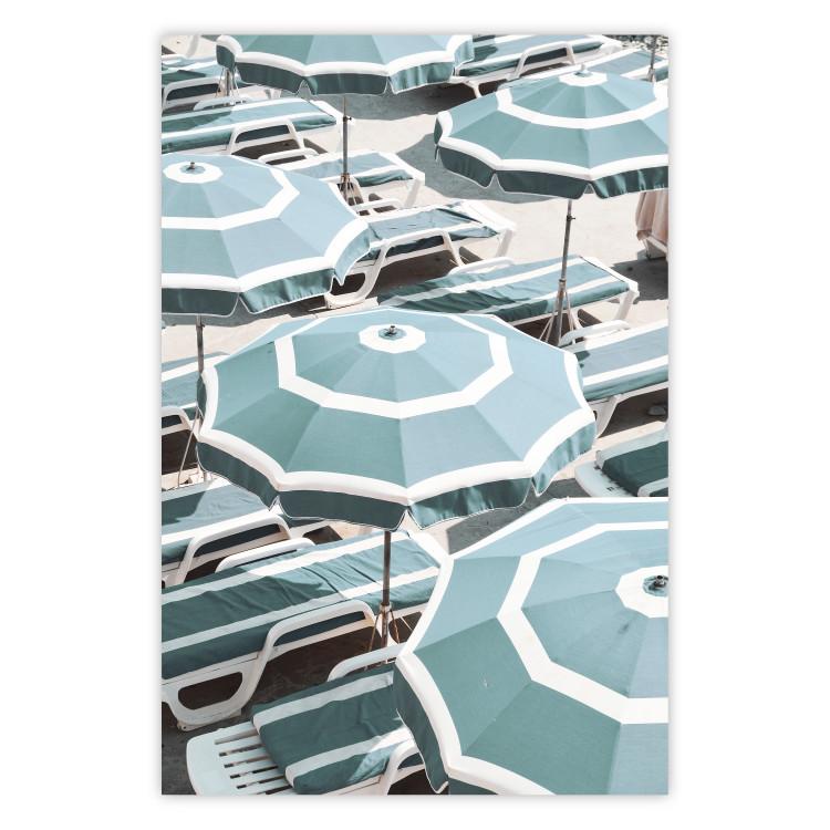 Turquoise Umbrellas - summer landscape of a sandy beach filled with sunbeds