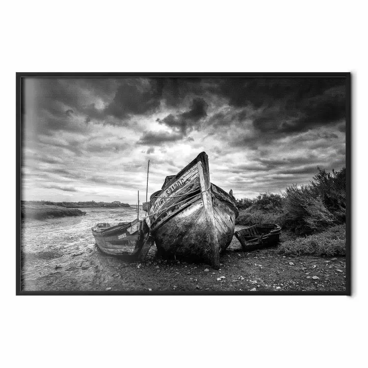 Journey into Nature - black and white abandoned boat against sky and clouds