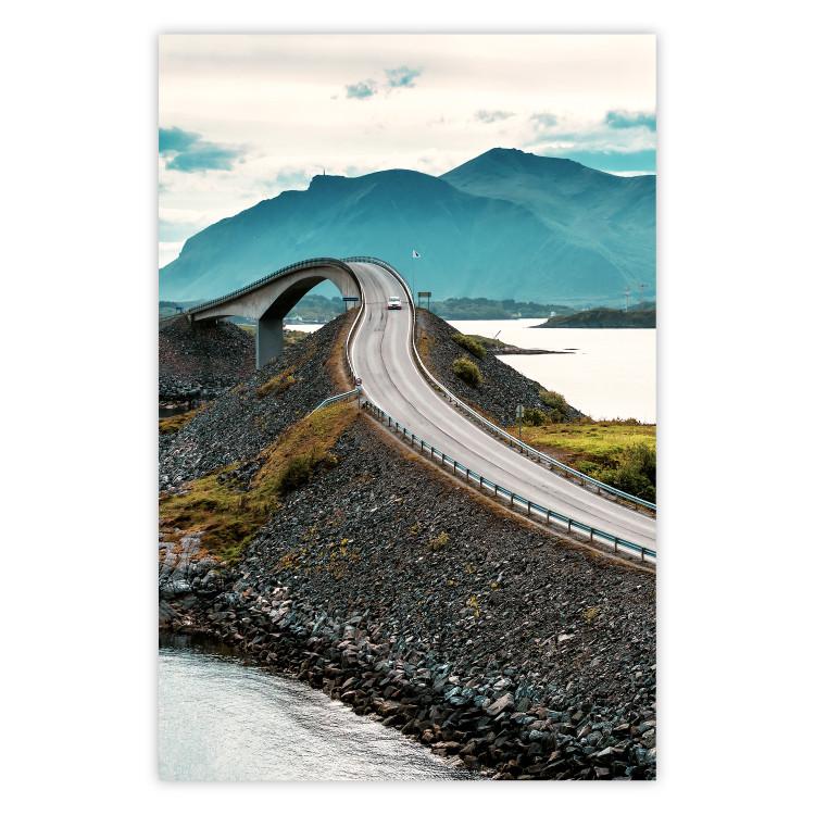 Road through Lakes - landscape of a road and bridge against tall mountains
