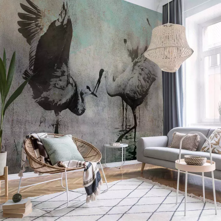 Wall Mural A pair of cranes - dancing birds on a gray background