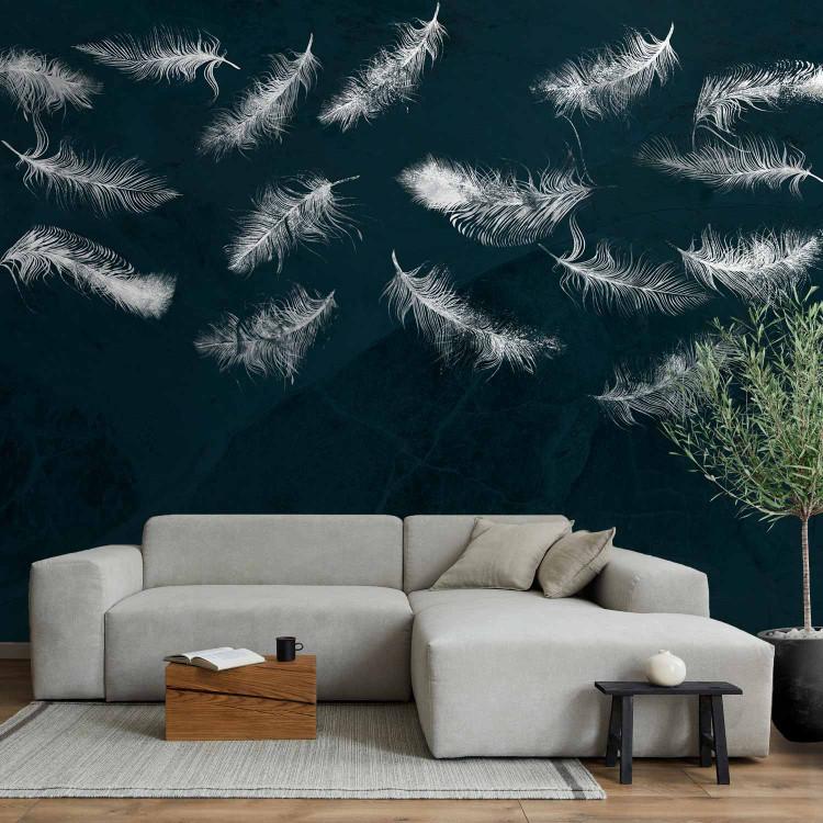 Wall Mural In flight - white feathers carried by the wind on a dark blue background with pattern