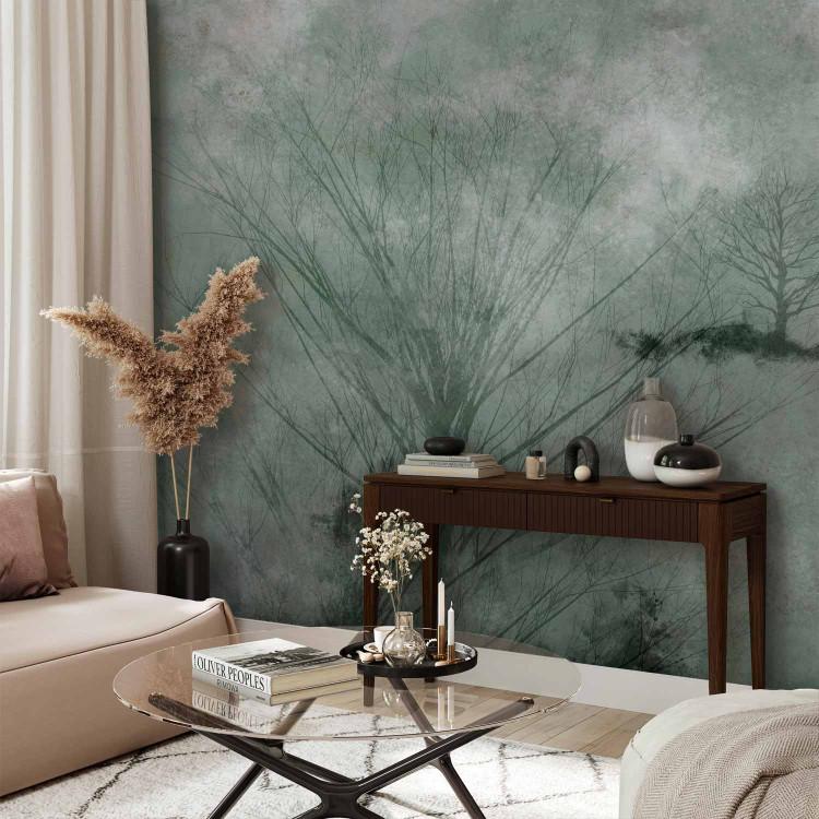 Wall Mural Winter abstraction - landscape with leafless trees in shades of green