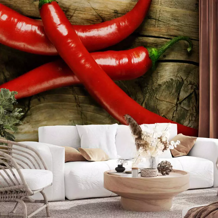 Wall Mural Spicy Flavours - Chili Peppers with Stems on a Wooden Board