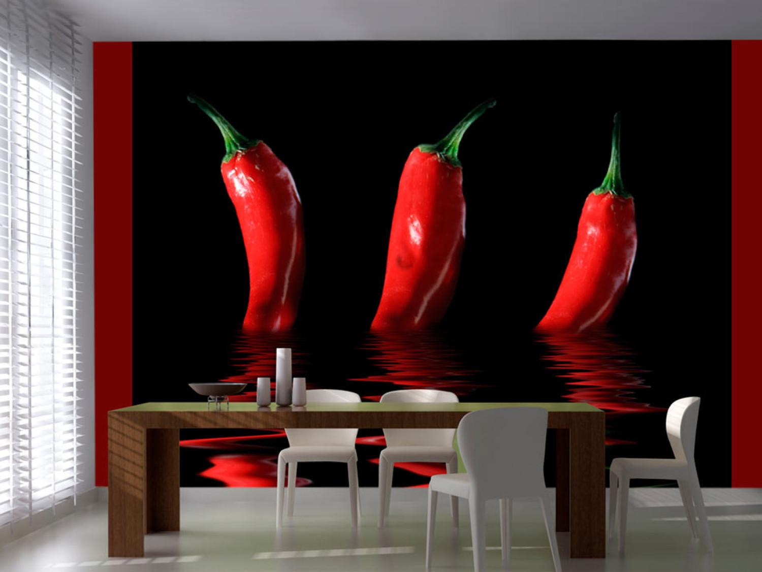 Wall Mural Spicy Flavours - Chili Pepper Emerging from Water with Reflection