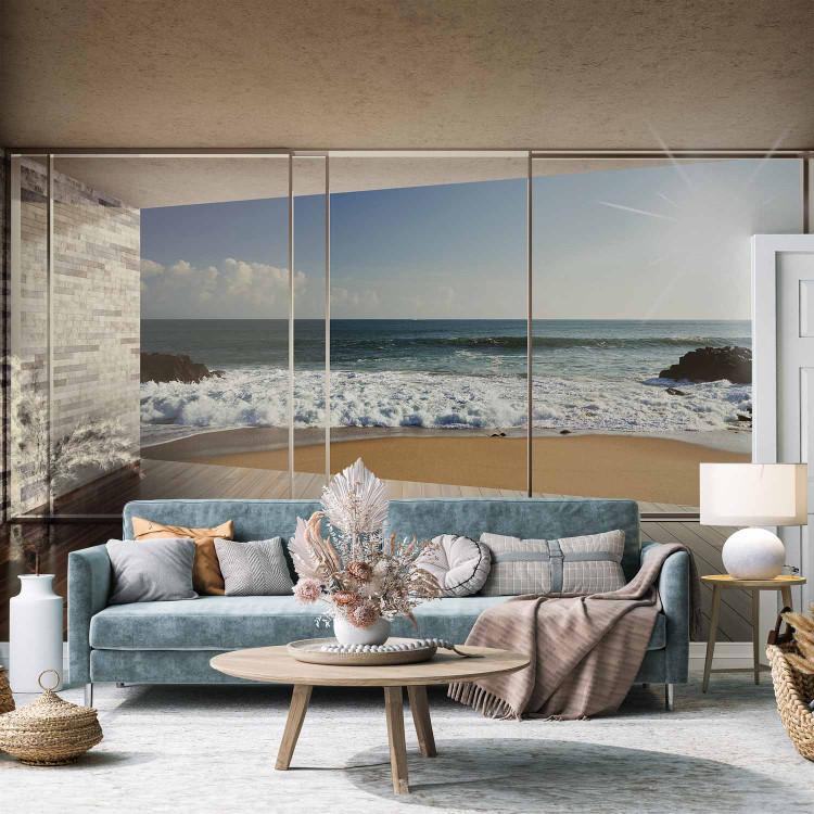 Wall Mural Window with view - sandy beach with rocks and sun in the sky