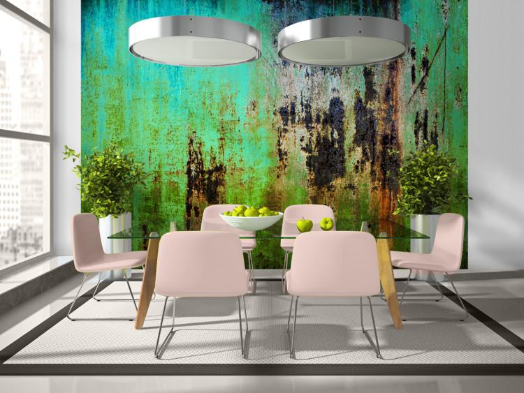 Wall Mural Emerald riddle - green background textured metal with cavities and rust