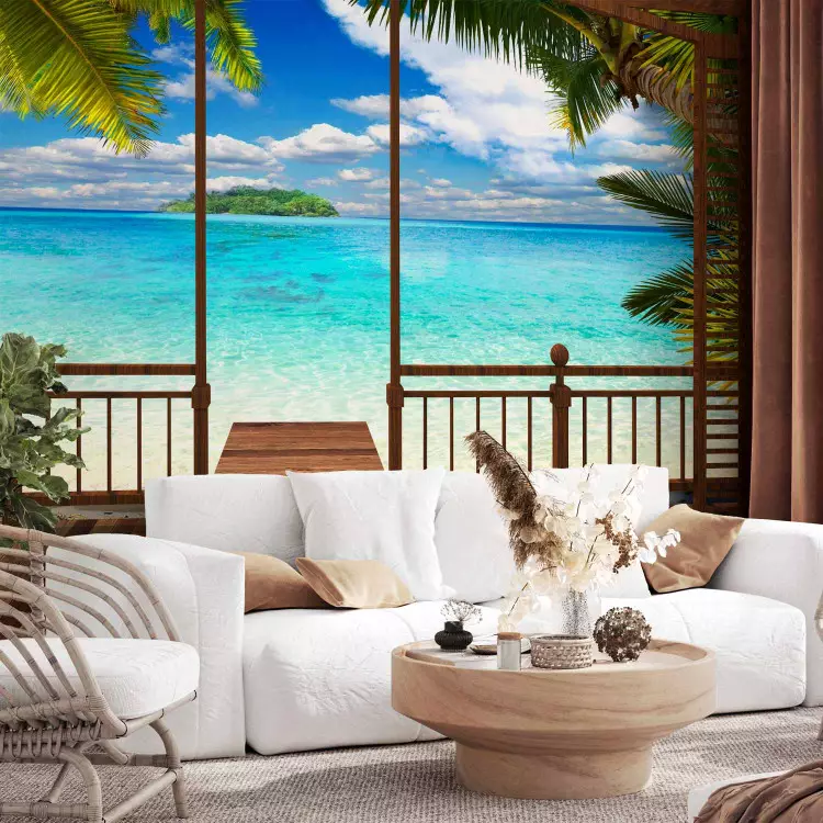 Wall Mural Window view - sunny landscape with a paradise beach surrounded by palm leaves