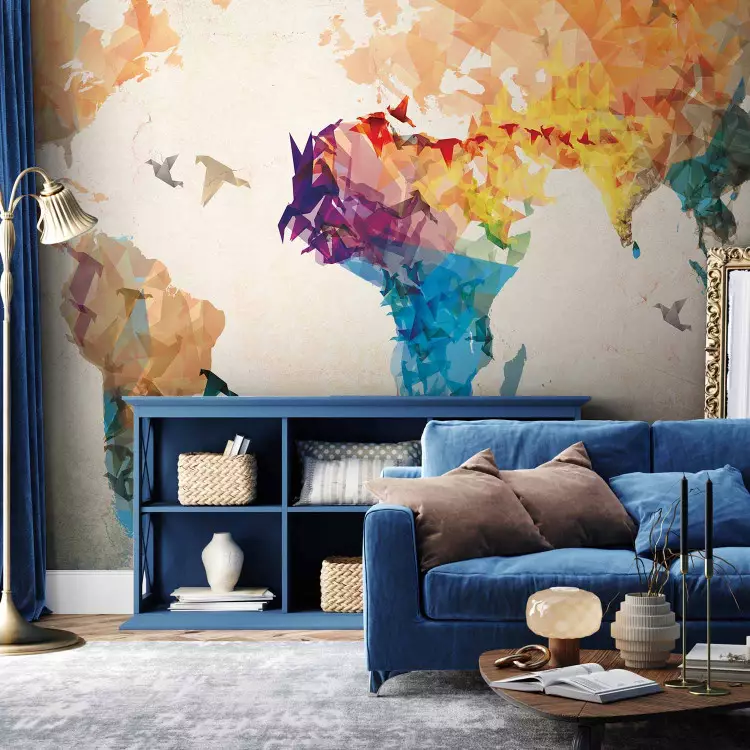 Wall Mural World map - colourful outline of the continents with a flying bird motif