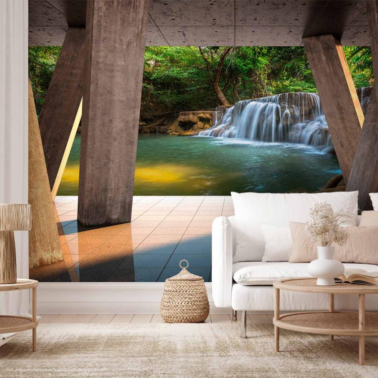 Wall Mural Landscape - nature with a tranquil waterfall against a backdrop of energetic jungle