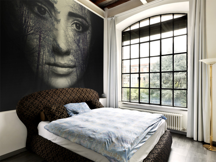 Wall Mural Woman of the Forest - Fantasy of a face with trees in the forest on a black background 61241