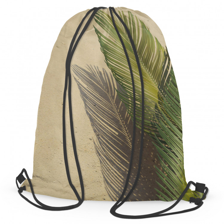 Backpack Palm shade - a minimalist floral composition on a sand background 147573